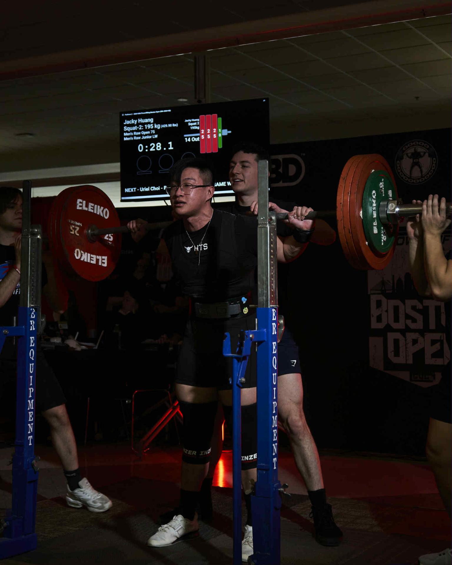 Jacky squatting at Boston Open competition